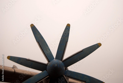  propellers of an old passenger plane in a hazy haze with blue frayed blades