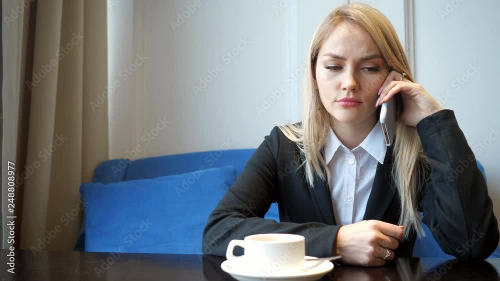 Young girl feels sad and crying while speaking with someone on cellphone, close up Young girl feels sad and crying while speaking with someone on cellphone, close up