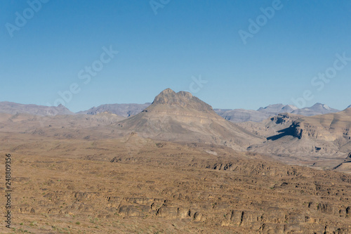 Morocco tourism: trekking man in mountains. Atlas mountains, Jebel Sakhro (Djebel Sahro), Ourzazate, Morocco