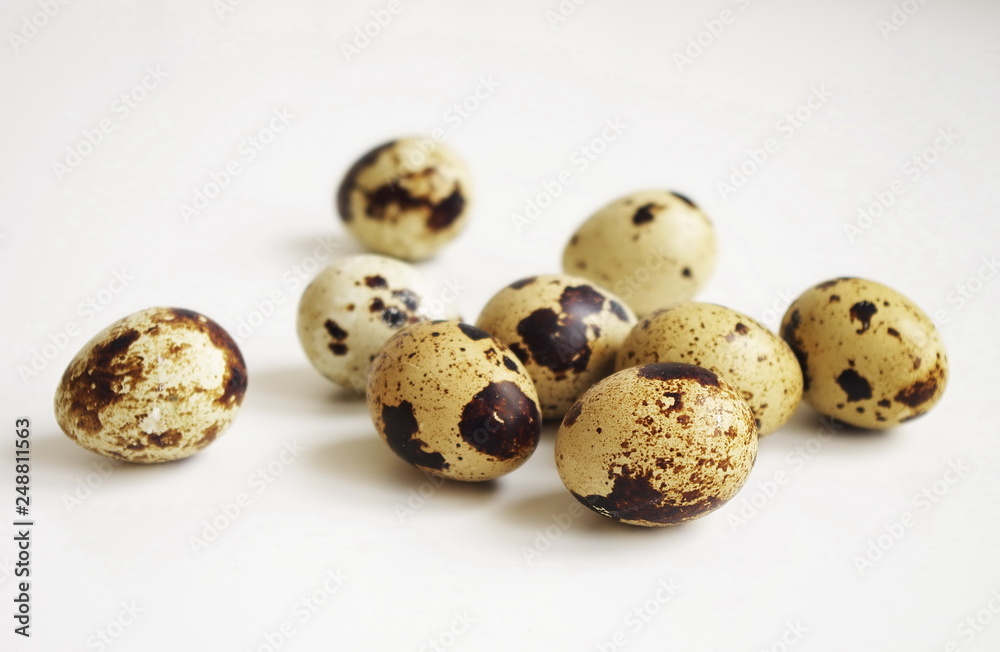 Quail eggs on white background , healthy and diet food, protein concept Quail eggs on white background , healthy and diet food, protein concept
