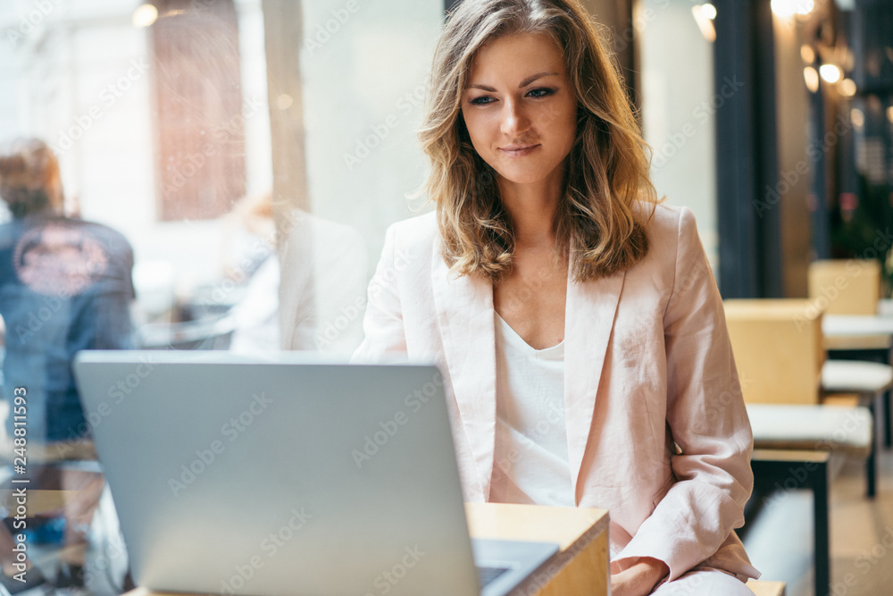 Successful manager having a video call interview with a boss and discussing business affairs, freelance lawyer working online via laptop in a coffee shop using wireless internet connection Successful manager having a video call interview with a boss and discussing business affairs, freelance lawyer working online via laptop in a coffee shop using wireless internet connection