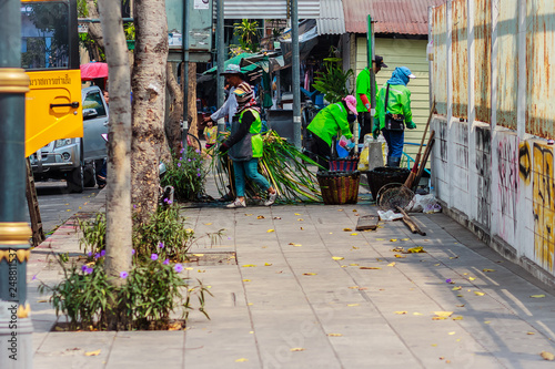 Photography Bangkok municipal staff in canal dredging work to dump vegetation trash to drain quickly