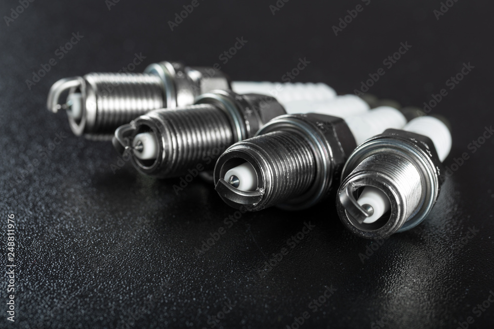 Spark plugs on black background Spark plugs on black background
