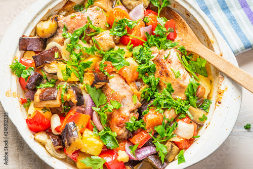 Homemade chicken stew with vegetables in a large pot - healthy organic food.