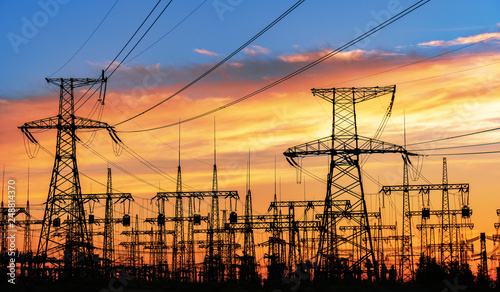 High-voltage power lines. Electricity distribution station. high voltage electric transmission tower. Distribution electric substation with power lines and transformers