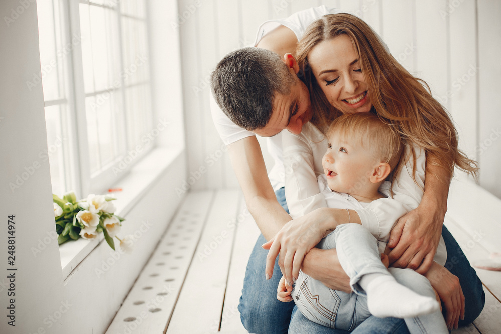 Family at home. Little girl with her brother. Mother and father with children Family at home. Little girl with her brother. Mother and father with children