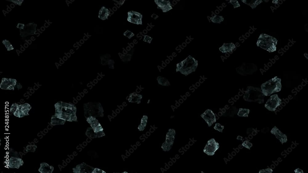 Particles of ice falling down on a black background Particles of ice falling down on a black background
