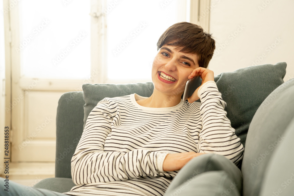 Portrait of young beautiful woman talking flirting and chatting on her smart phone Portrait of young beautiful woman talking flirting and chatting on her smart phone