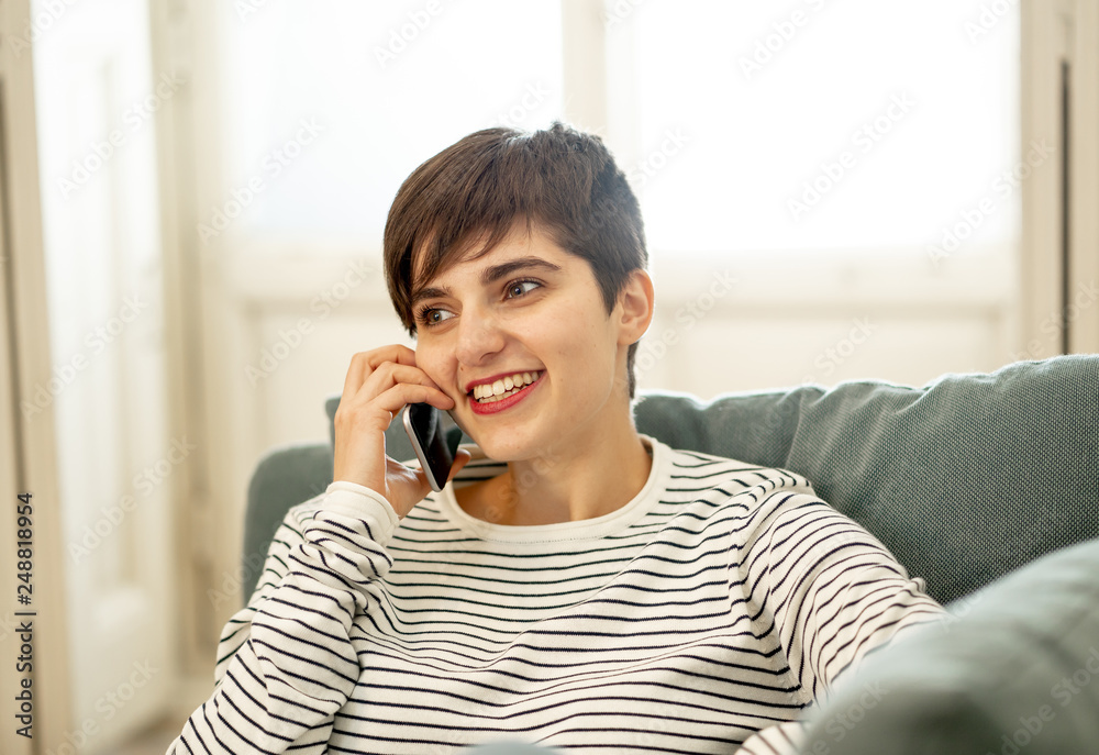 Portrait of young beautiful woman talking flirting and chatting on her smart phone Portrait of young beautiful woman talking flirting and chatting on her smart phone