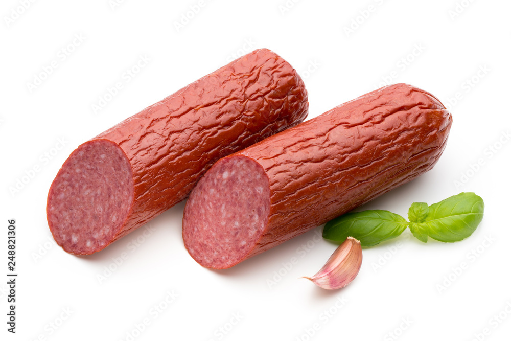 Salami smoked sausage, basil leaves on white background cutout. Salami smoked sausage, basil leaves on white background cutout.