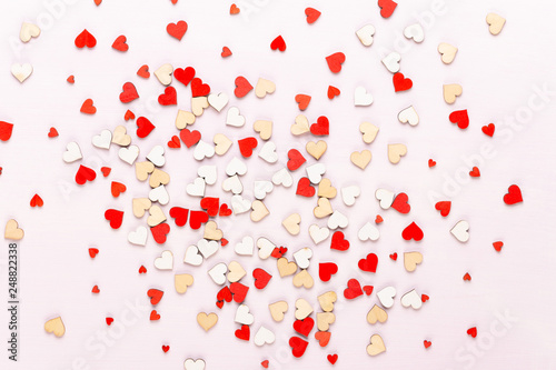 Happy Valentines day background. With small color hearts on gray background.