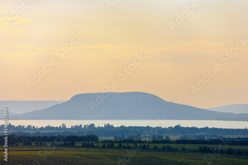 he Badacsony mountain with Lake Balaton at sunset in Hungary © andras_csontos