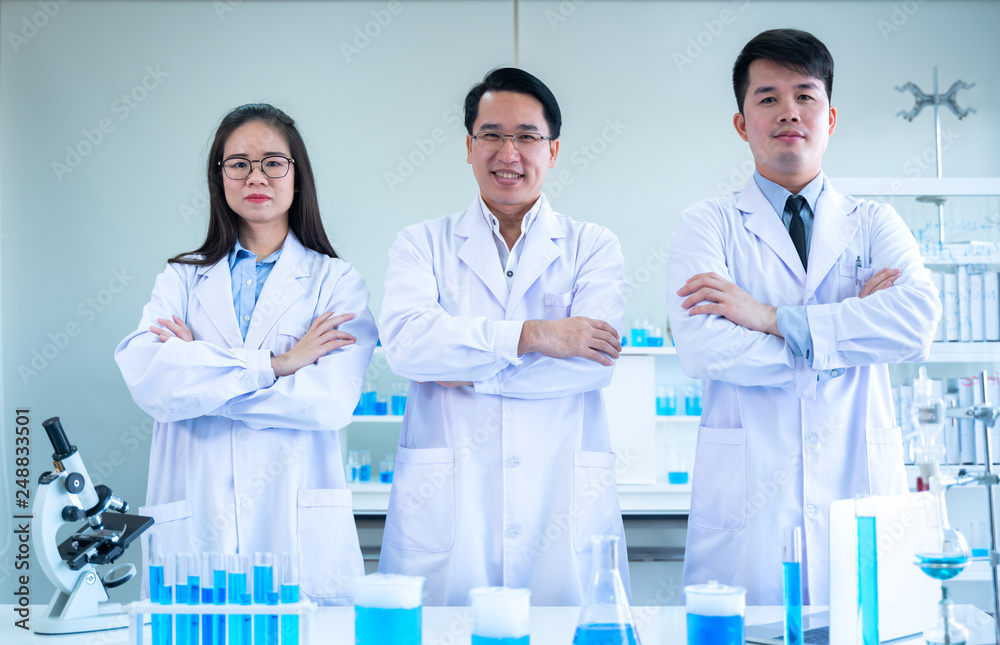 scientists standing and crossing arms scientists standing and crossing arms