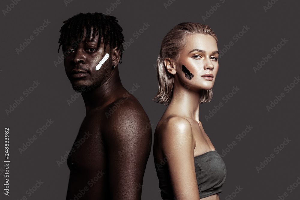 African-American man with dreadlocks posing with woman African-American man with dreadlocks posing with woman