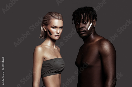 Slim appealing models with different skin color posing together