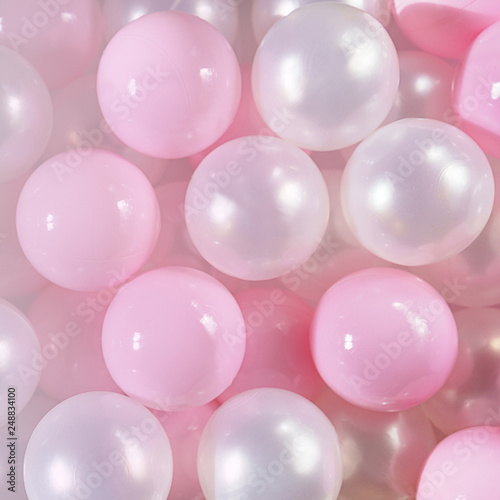 Pink and white balls, pastel pink bubbles for beautiful birthday texture background. Top view, flat lay