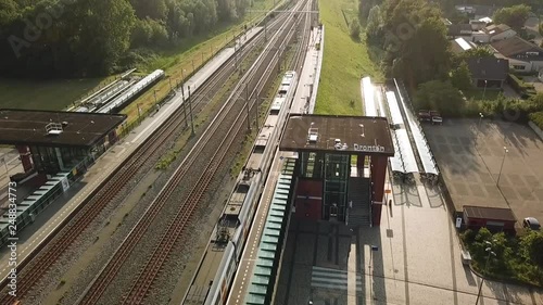 Drone view of a train leaving Dronten, Flevoland, The Netherlands. photo