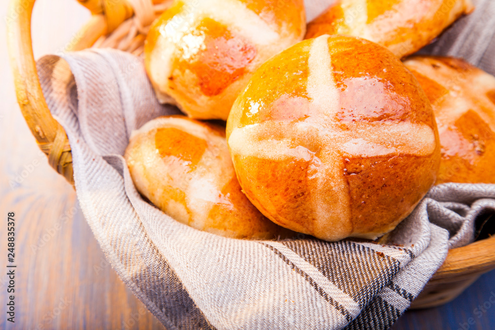 Hot cross buns on basket Top view, copy space. Easter baking Hot cross buns on basket Top view, copy space. Easter baking