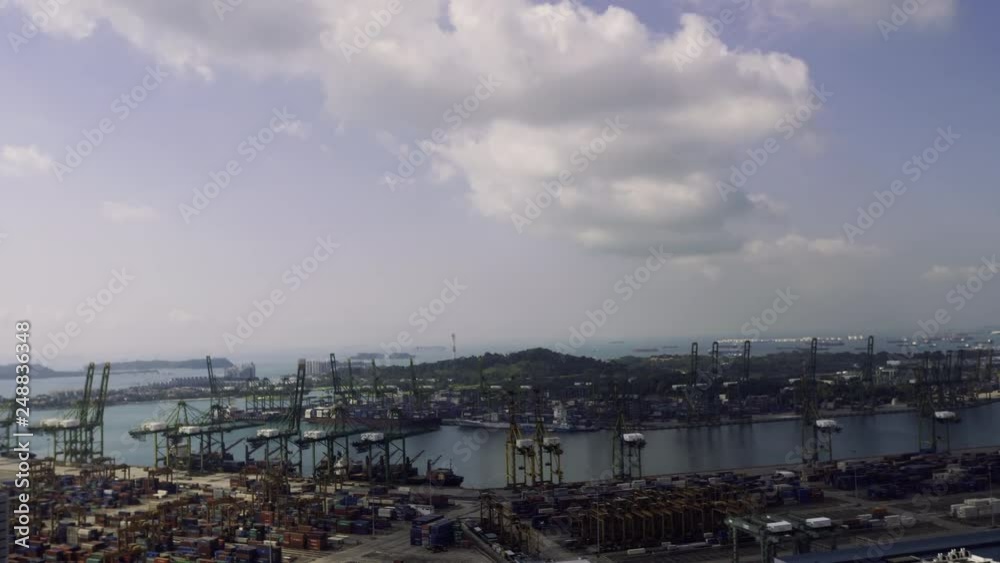 Bird eye panoramic view of busiest Asian cargo port. Commercial port of Singapore real time. Bird eye view Bird eye panoramic view of busiest Asian cargo port. Commercial port of Singapore real time. Bird eye view
