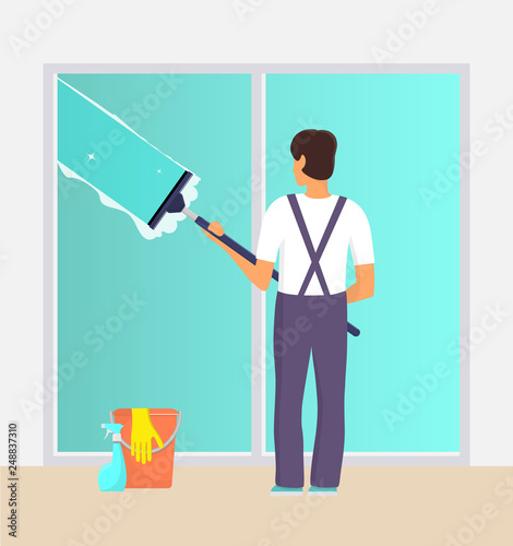 Man in uniform cleaning window with glass scraper and washing spray. Window washer with squeegee. Housekeeping service, office cleaning service, spring cleaning duty. Vector illustration.