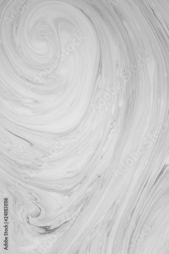 Abstract monochrome marble background. Stains of paint on the surface of the water.