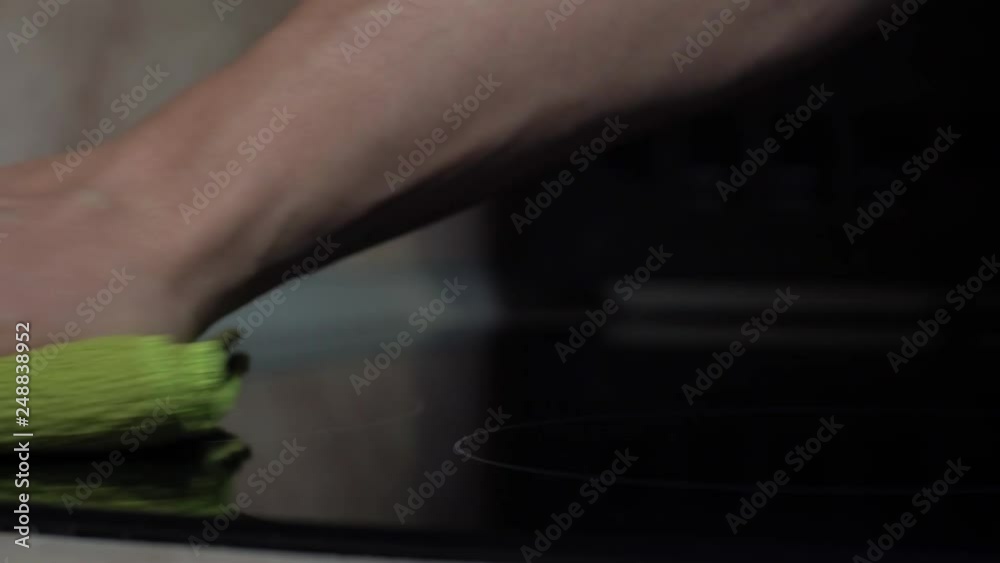 Close-up - The Hands Of A Young Man Rub The Cooking Surface Close-up - The Hands Of A Young Man Rub The Cooking Surface