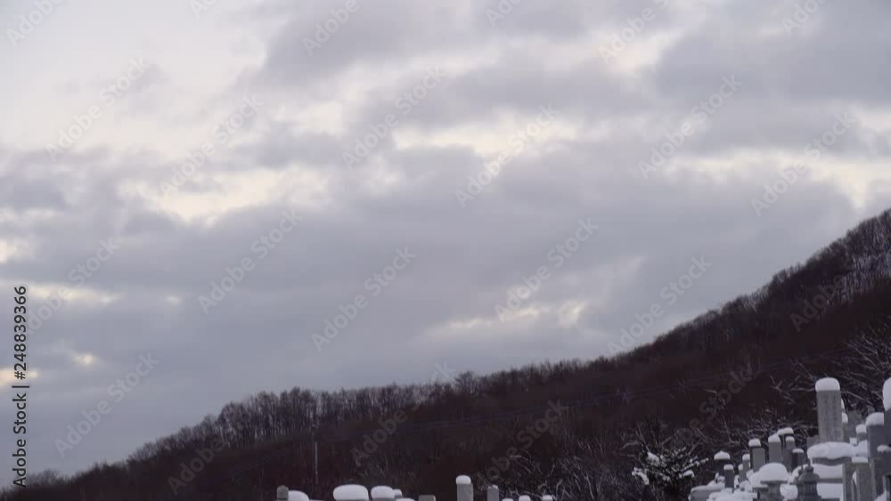 Creepy Graveyard Covered in Deep Snow in Winter in Hokkaido, Japan Creepy Graveyard Covered in Deep Snow in Winter in Hokkaido, Japan