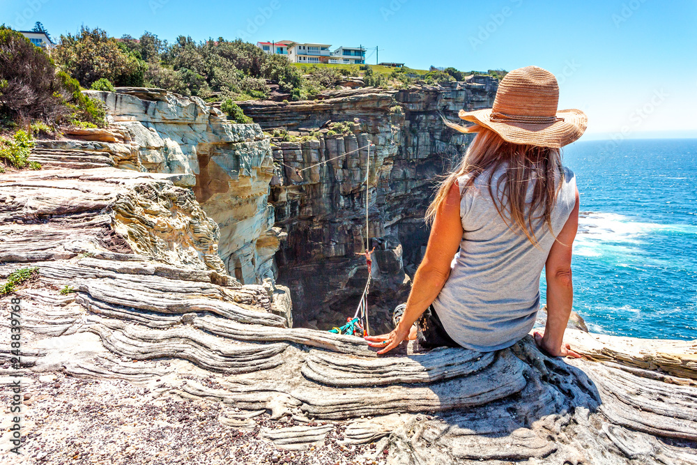 Fototapeta premium Best views watching highliners walk across high above the ocean