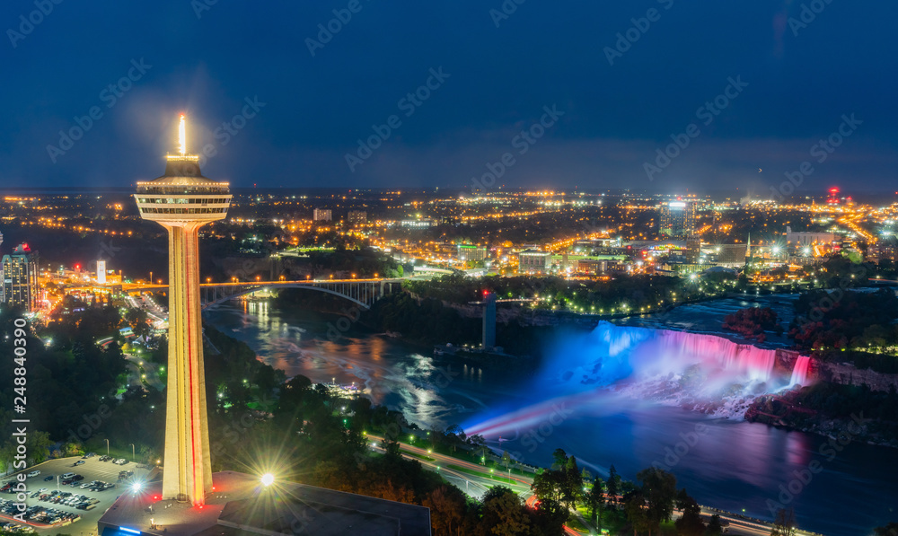 Night aerial view of the Skylon Tower and the beautiful Niagara Falls