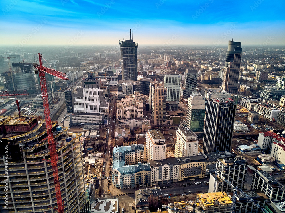 WARSAW, POLAND - FEBRUARY 10, 2019: Beautiful panoramic aerial drone view to panorama cityscape of Warsaw modern City, Mennica Legacy Tower and 