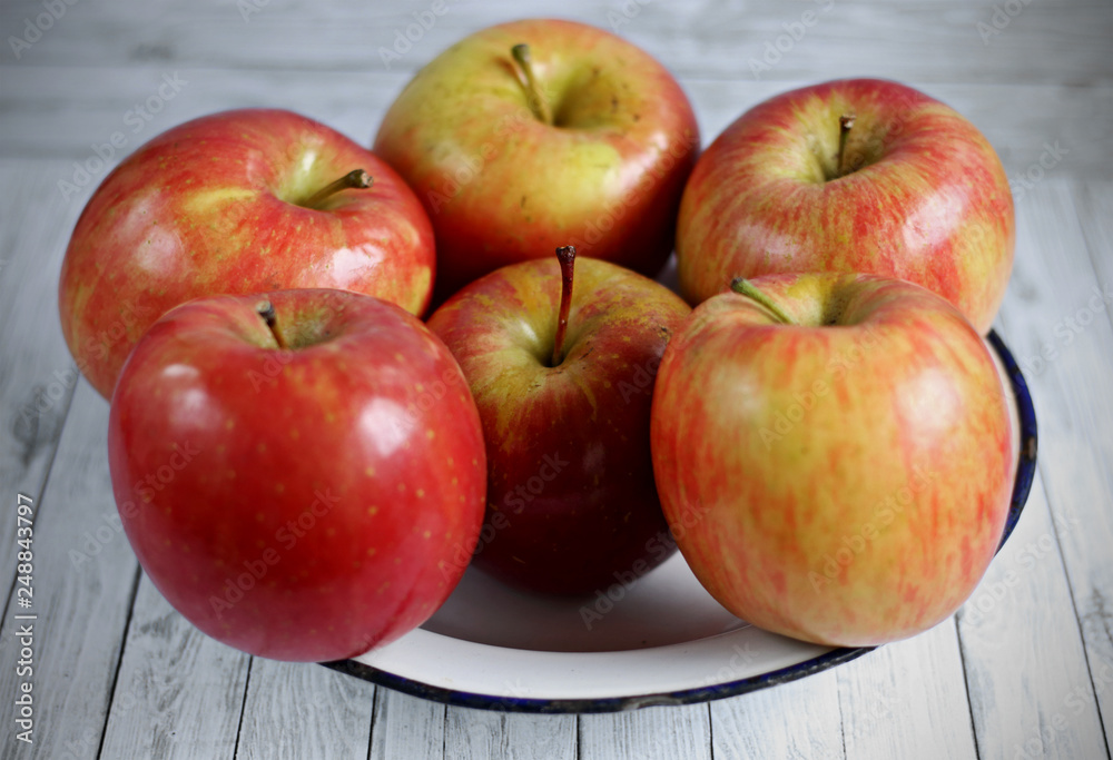 Fresh red apples on white wooden background Fresh red apples on white wooden background