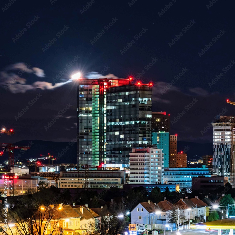 Moon touching the roof of an office building Moon touching the roof of an office building