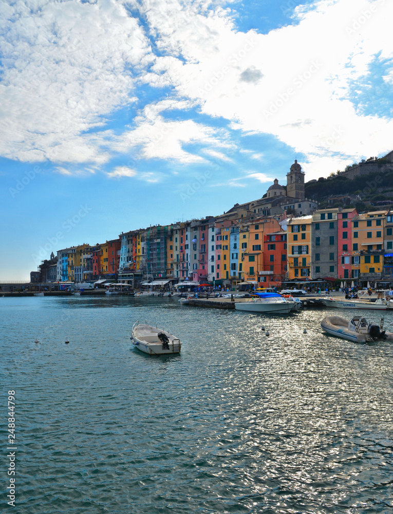 Picturesque panorama with landscape of the harbor with colorful houses and the boats in Porto Venere, Italy, Liguria