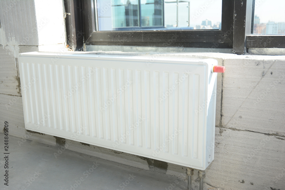 custom made wallpaper toronto digitalInstalling metal white radiator heating with thermostat in new house construction.