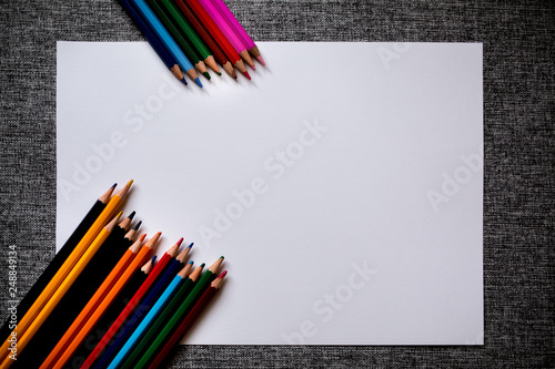 colored pencils with a white sheet