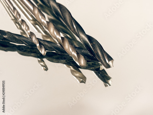 metal drill in assortment on a white background photo