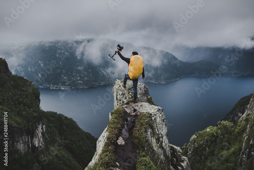  Outdoor & Nature Filmmaker on Mountaintop in Norway Cinematography Adventure getting the Shot photo