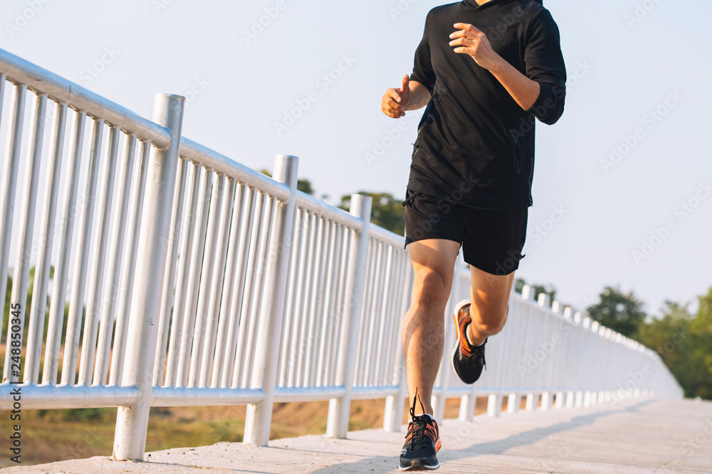 custom made wallpaper toronto digitalyoung man runner running on running road in city park