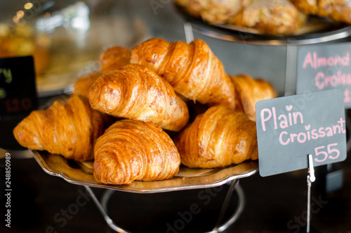 Croissant is a type of bread that is put together on an iron tray.