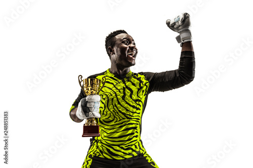 The celebrating soccer player with ball and cup isolated on white background. Competition winner concept