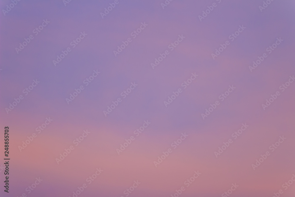 Red clouds on blue sky in twilight evening. Beautiful sunset sky with blue and red background. Dramatic colorful of dusk and dawn sky with blue sky and red clouds.