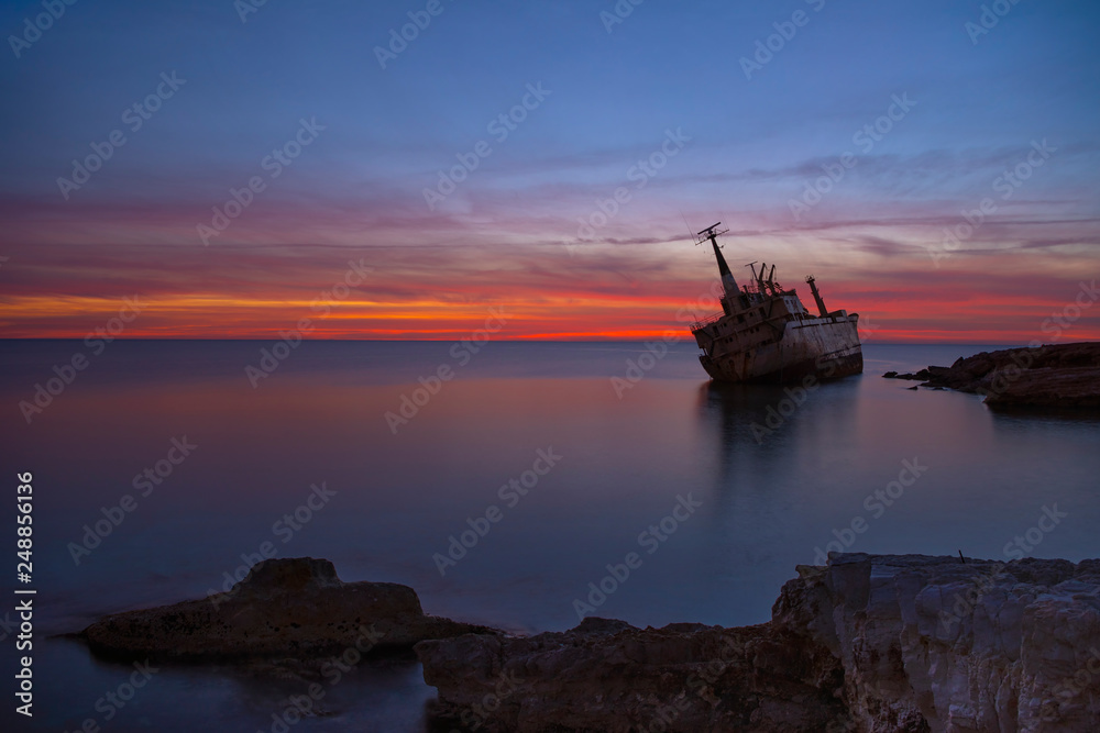 Beautiful seascape and shipwreck. Abandoned ship Edro III at sunset near the Paphos, Cyprus. Beautiful seascape and shipwreck. Abandoned ship Edro III at sunset near the Paphos, Cyprus.