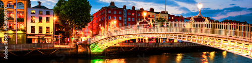 Canvas Print Night view of famous illuminated Ha Penny Bridge in Dublin, Ireland at sunset