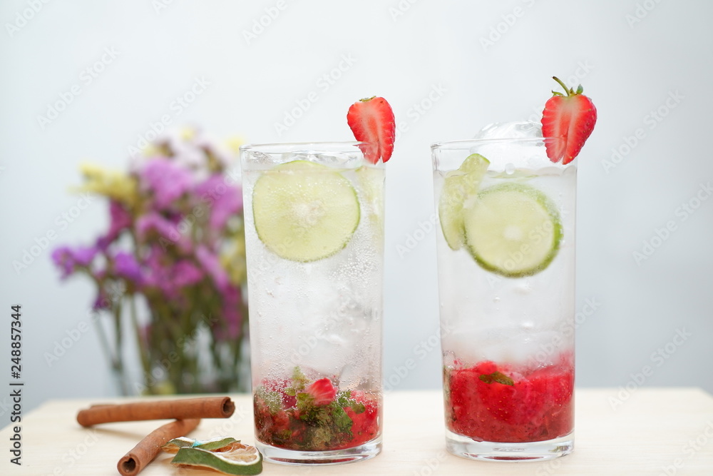 Strawberry mojito cocktail on wood table Strawberry mojito cocktail on wood table