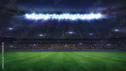 grand football stadium middle view illuminated by spotlights and empty green grass photo