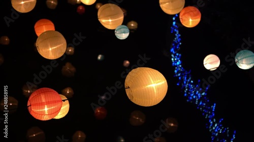 4K, Asian lantern decoration hanging over the river at night during the Chinese New Year. Beautiful traditional lanterns of diferent colors at Tainan city. Yuejin Lantern Festival in Yanshui-Dan photo