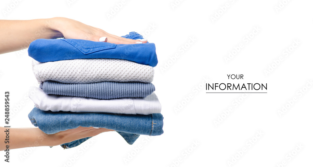 Stack of clothing jeans sweaters in hand pattern on a white background isolation - obrazy, fototapety, plakaty 