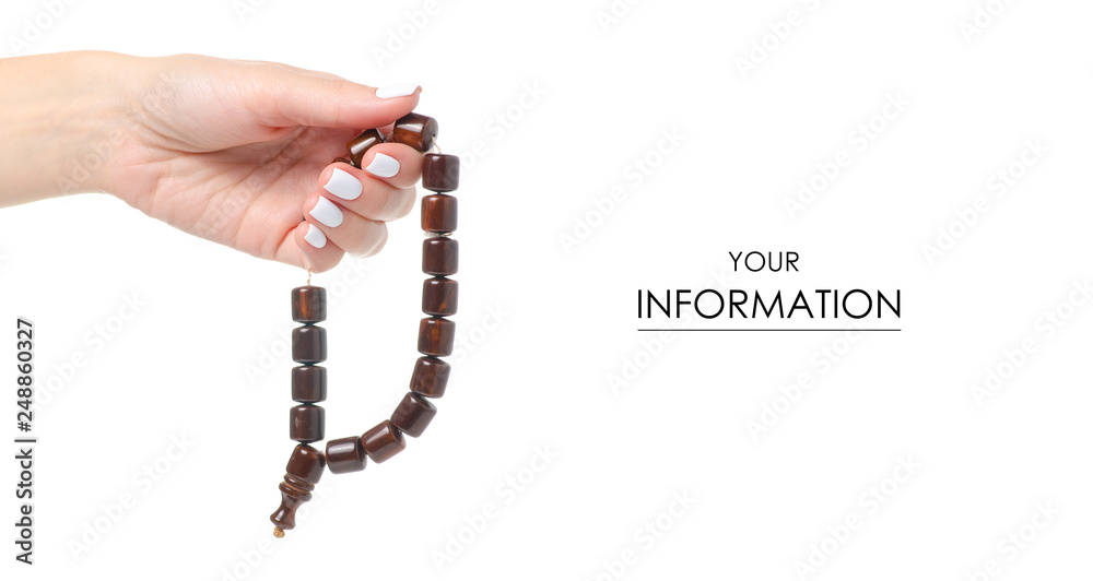 Wooden rosary in hand pattern on white background isolation Wooden rosary in hand pattern on white background isolation