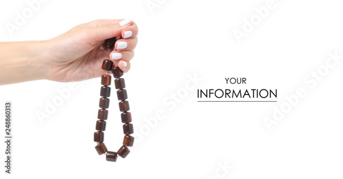 Wooden rosary in hand pattern on white background isolation