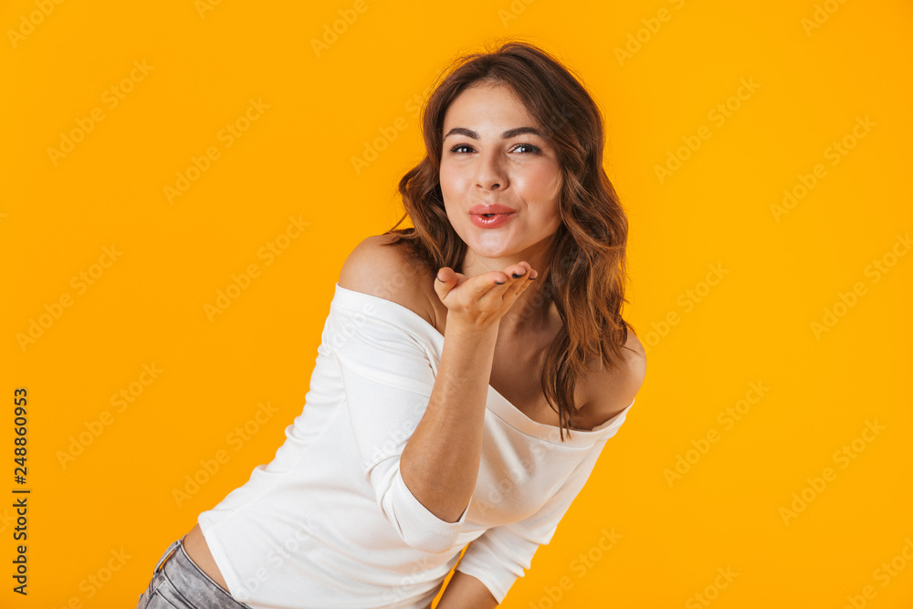 Portrait of a cheerful young woman wearing white shirt Portrait of a cheerful young woman wearing white shirt